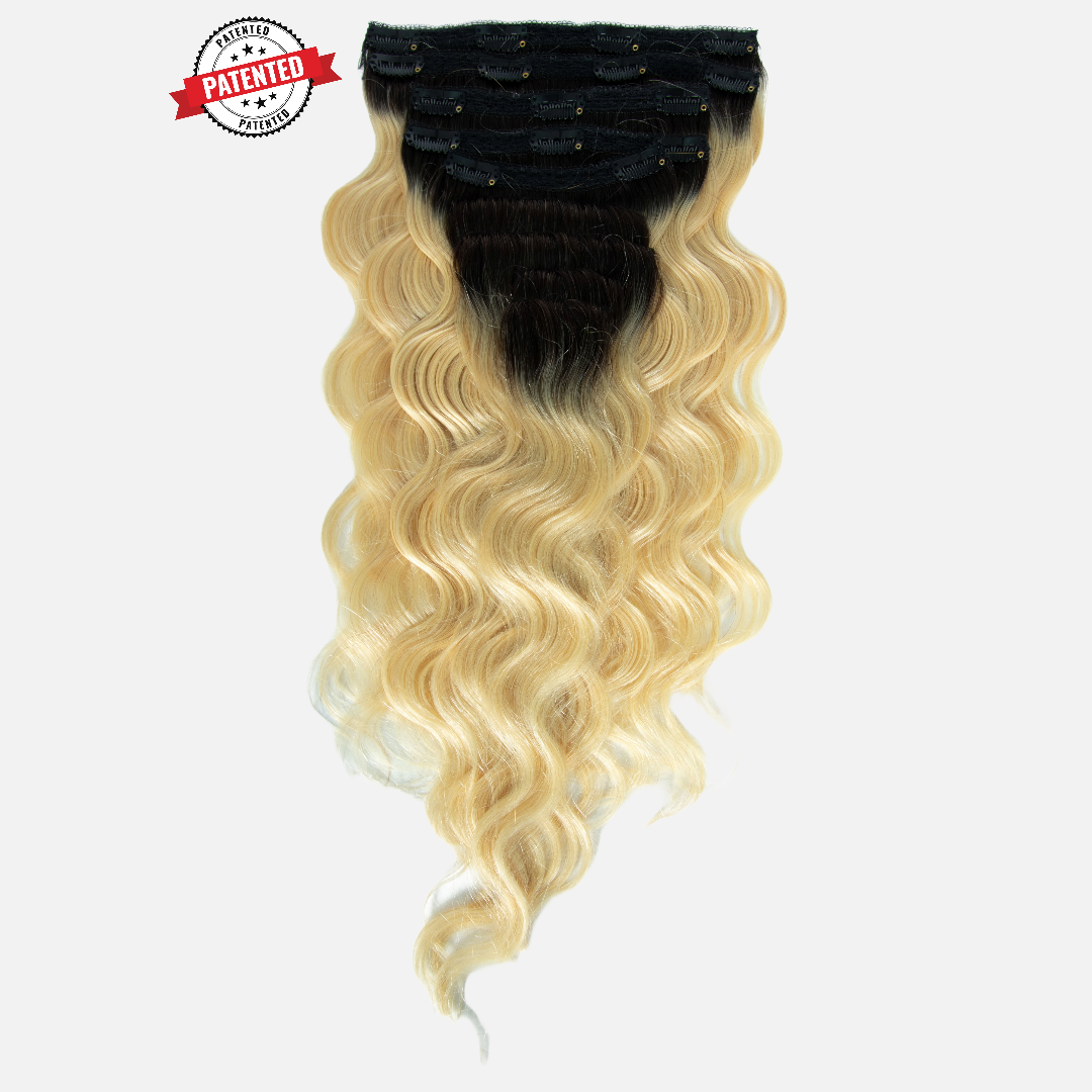 Upgrade from competitor's Follicle Fusion™ Clip-ins to our Patented InVisiRoot® Clip-ins. Experience True Undetectable Results: This is Lauren Dark Roots Blonde Cambodian Body Wavy texture InVisiRoot® Clip-ins